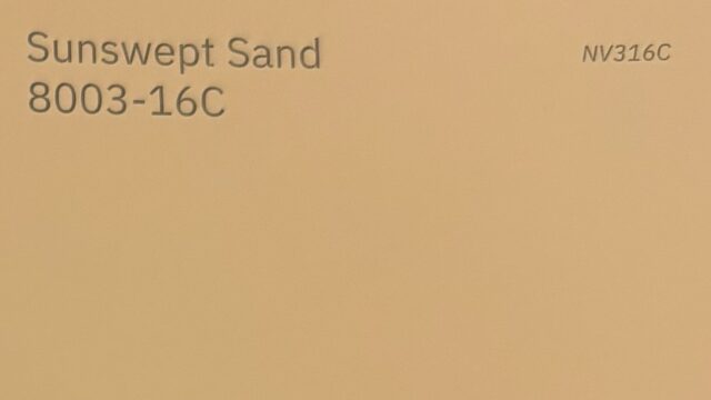 Paint chip labeled "Sunswept Sand"