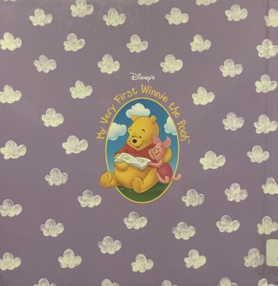 Back of A Bedtime Story for Pooh, featuring a purple sky full of white clouds with a center embed featuring Winnie the Pooh and Piglet reading a book. The emblem is titled "My Very First Winnie the Pooh"